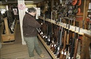 Man at rifle rack