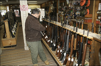 Man at rifle rack